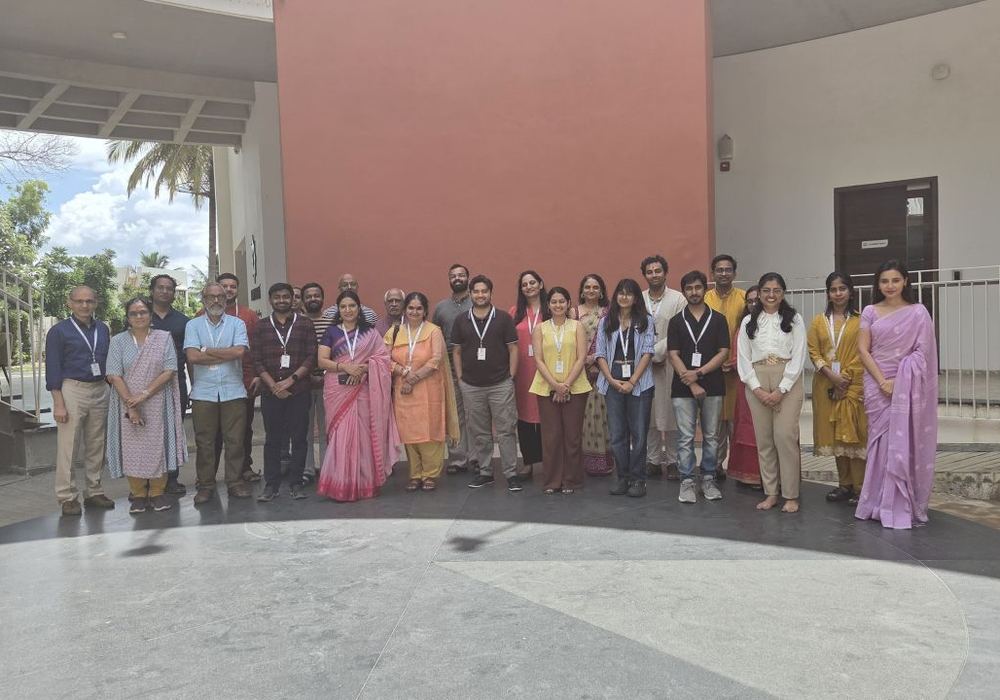 Participants and organisers gathered outside the venue after the Aucitya session in Bengaluru