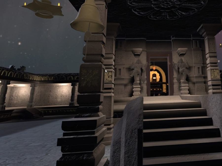 Interior of the Shiva Sannidhi immersive environment with carved stone pillars and a lit sanctum